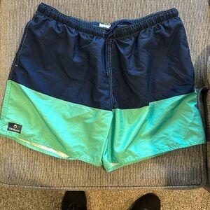 D09.9. Tribord men’s swim trunks color block navy blue/ green Sz 32 W
